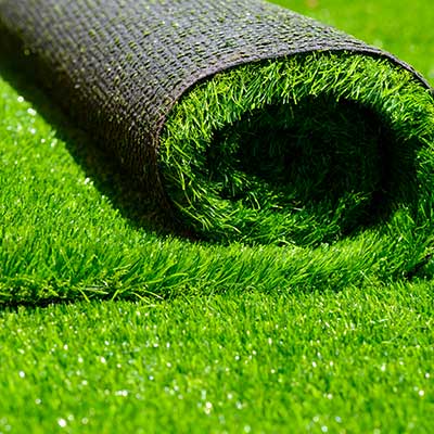 Artificial grass being unrolled